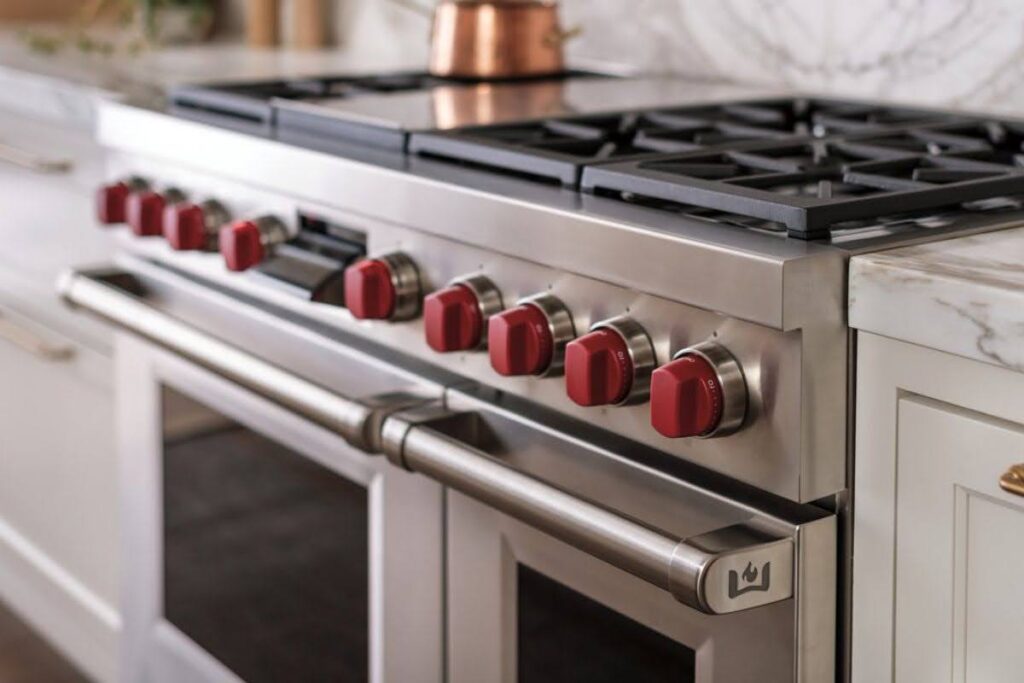 Premium appliance repair in Las Vegas technician working on high-end kitchen equipment